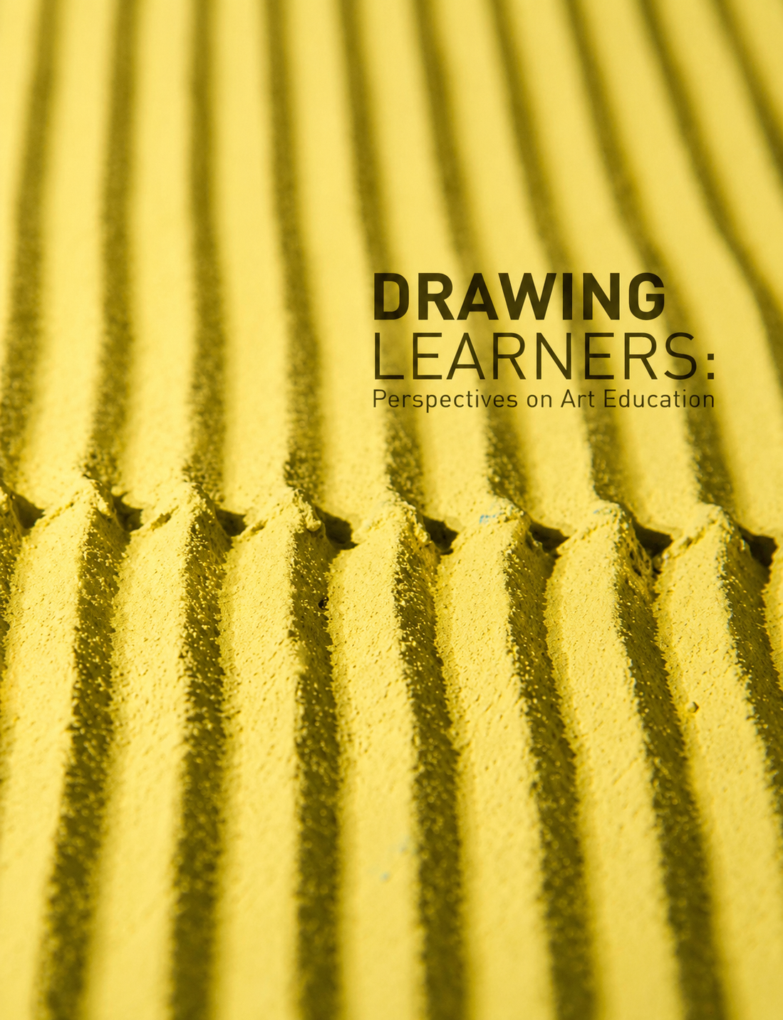 Book cover with yellow textured ridged surface and black text reading Drawing Learners: Perspectives on Art Education.